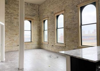 Exposed Brick with large windows in living room